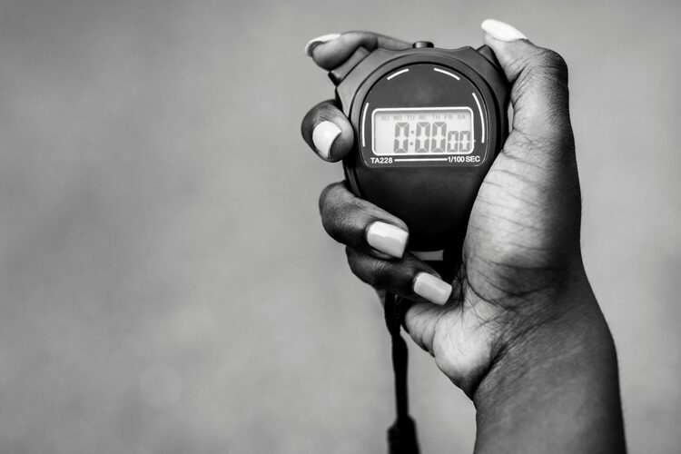 Hand Holding Stopwatch