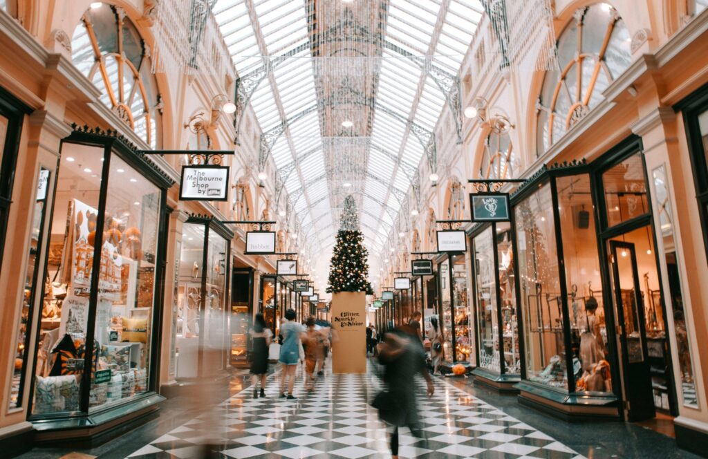 Shoppers in a mall decorated for the holidays