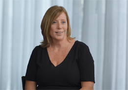 Image of Stephanie sitting and smiling.