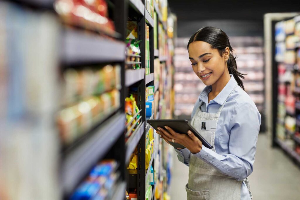 Grocery Associate Using Tablet