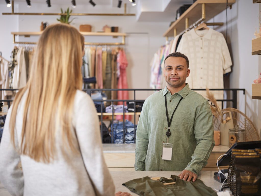 A cashier handling a purchase made by a customer