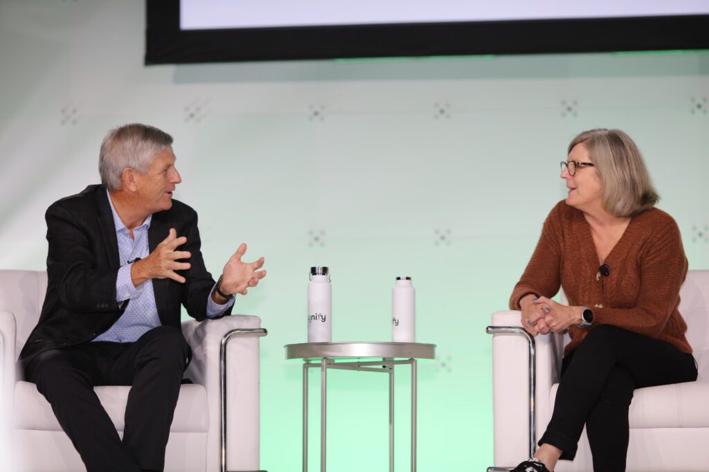 Former CEO of Foot Locker Dick Johnson and CRO of Axonify Christine Tutssel at AxoniCom 2023