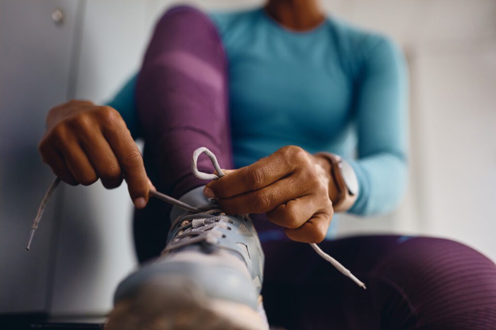 Woman Tying Shoelaces