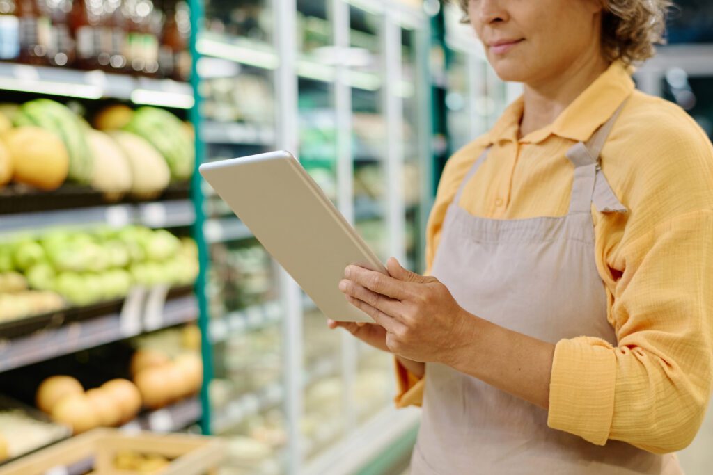 Manager Of Supermarket Using Tablet Pc